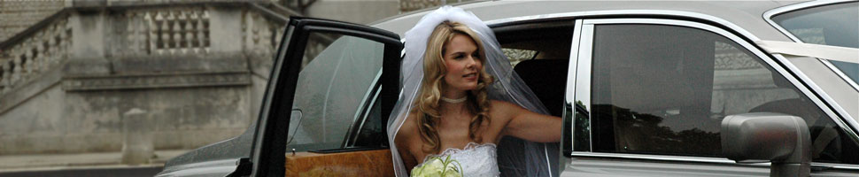 Bride exiting from Rolls-Royce Phantom wedding car