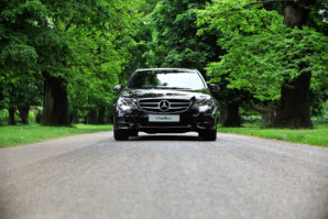 Front of Mercedes E Class chauffeur car in black