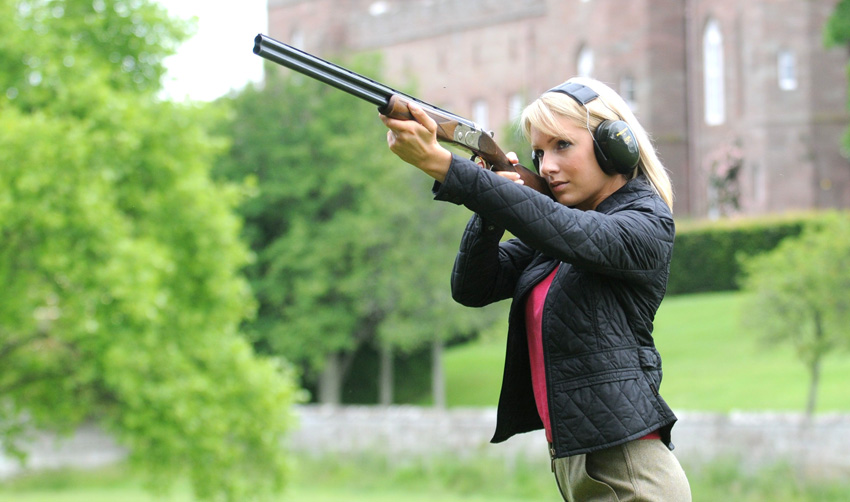 Woman with shotgun
