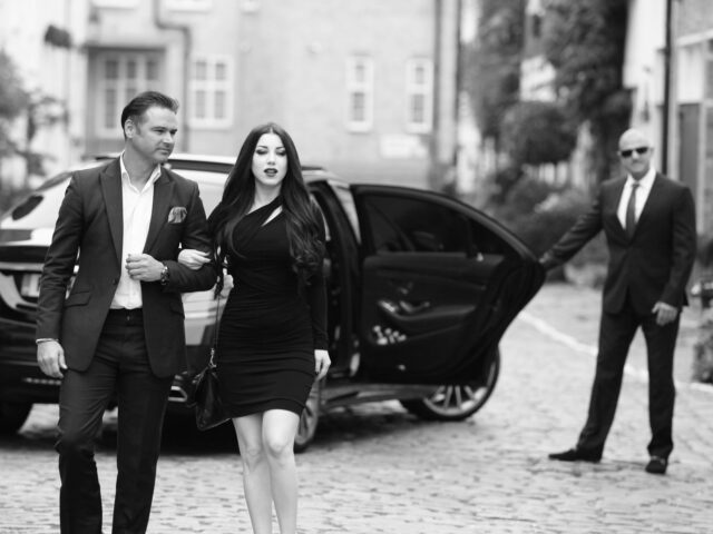 Passengers walking away from chauffeur