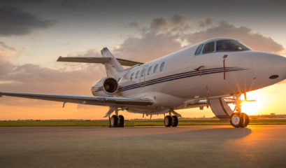 Private Jet on runway during sunset