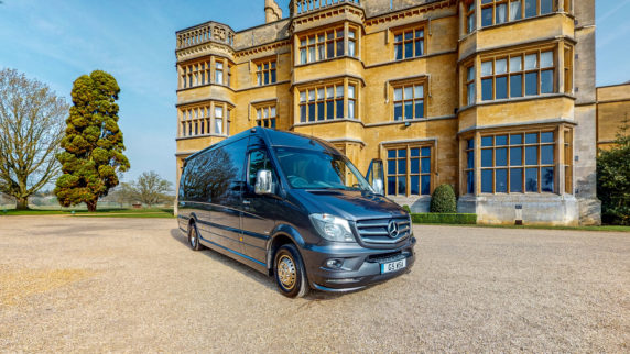 Luxury Minibus in grey outside a stately home