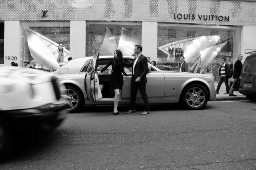 Rolls-Royce Phantom chauffeur car in London street with 2 passengers