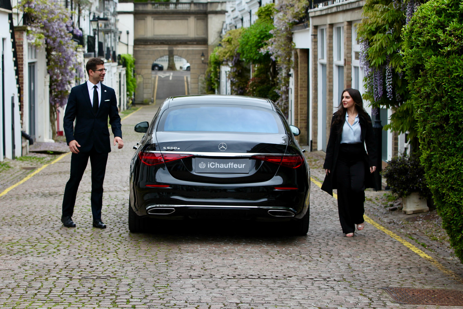 Mercedes S-class with passenger and chauffeur