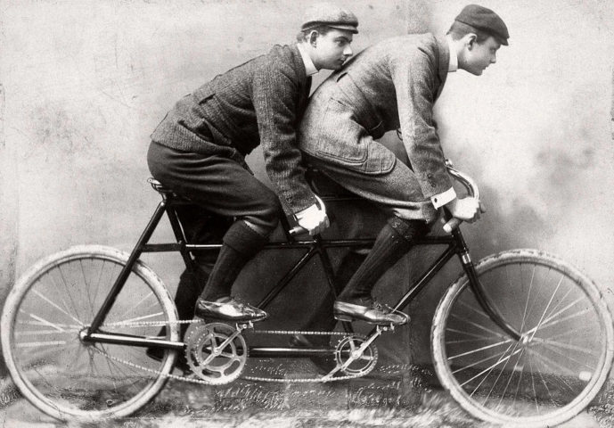 Charles Rolls on front of tandem bicycle in late 1800s