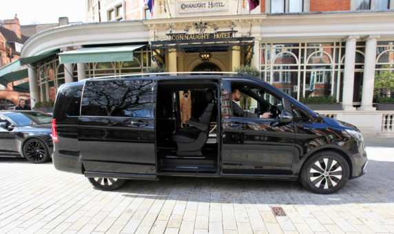 Mercedes EQV outside the Connaught Hotel, Mayfair, London with a chauffeur & doorman