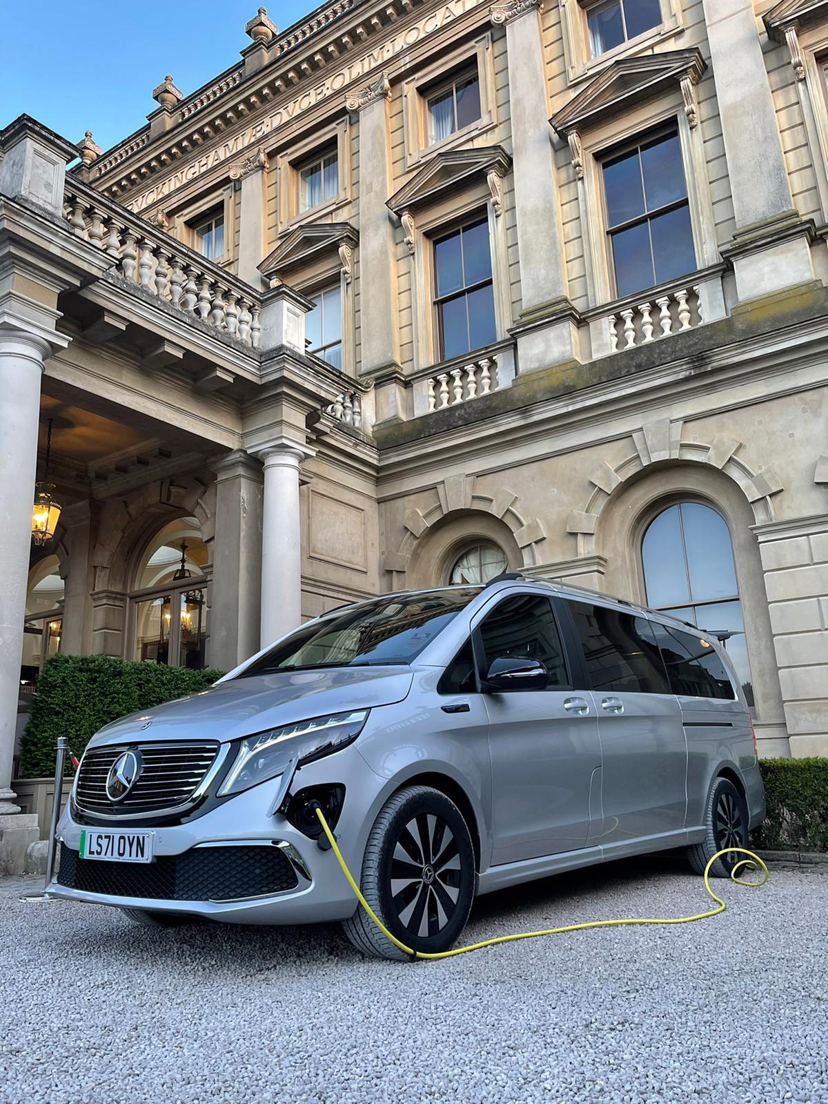 Silver Mercedes EQV chauffeur vehicle on charge at Cliveden House Hotel & Spa