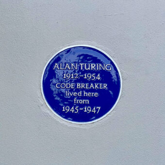 Blue plaque in Hampton on white wall. Alan Turing 1912-1954 Code Breaker lived here from 1945-1947