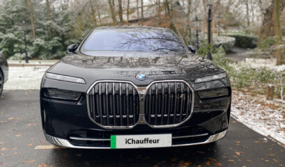 BMW i7 chauffeur car in black, front grill with iChauffeur number plate