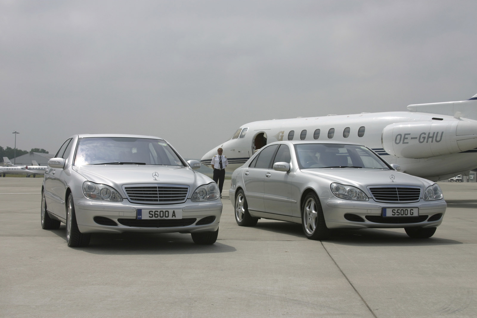 2 Mercedes S-Class chauffeur cars in front of private jet