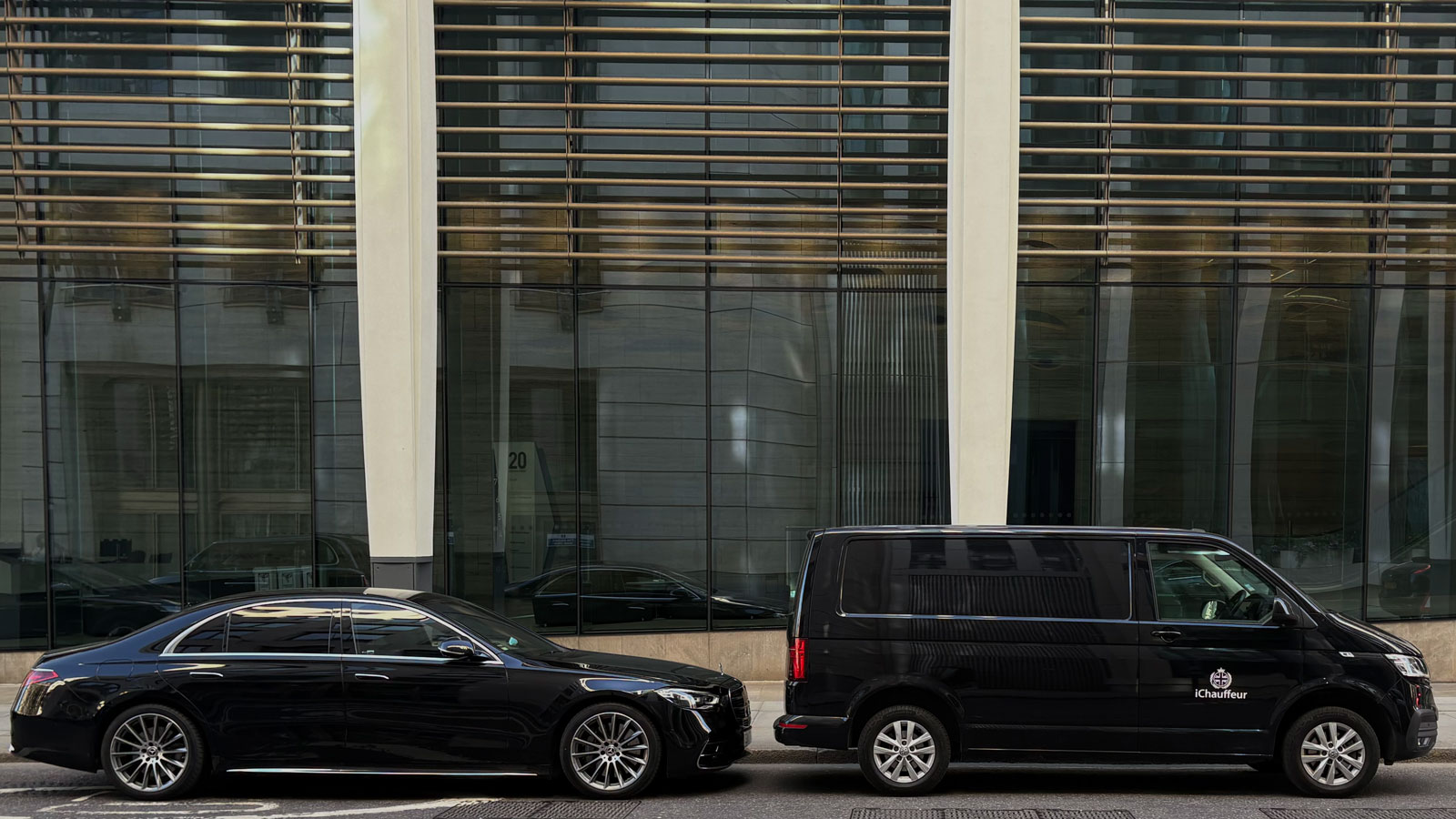 Black VW van and Mercedes S-Class in London
